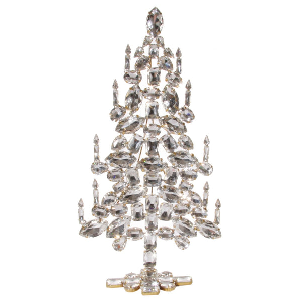 A clear glass and crystal Christmas tree decoration with a geometric pattern and hanging gem-like ornaments, adorned with candles.