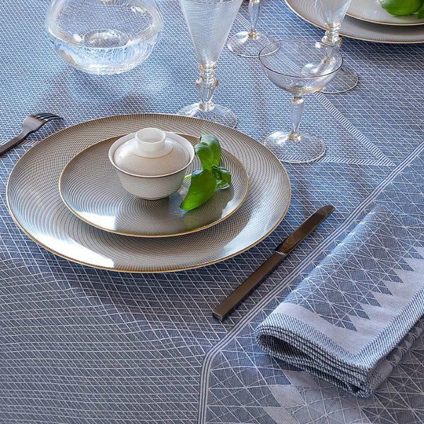 Le Jacquard Français Club blue cotton tablecloth with tone-on-tone jacquard, styled in a coastal-inspired luxury dining setting