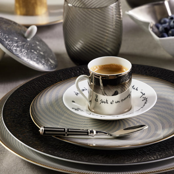 Styled table with Luxury porcelain coffee cup with Cocteau quote Le Gabier de Vigie Raynaud