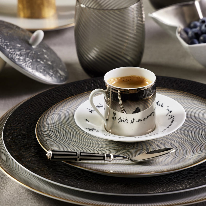 Styled table with Luxury porcelain coffee cup with Cocteau quote Le Gabier de Vigie Raynaud