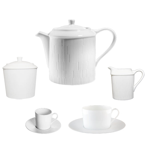 A 15-piece white porcelain dinnerware set including a teapot, coffee cups and saucers, tea cups and saucers, a sugar bowl, and a milk jug.