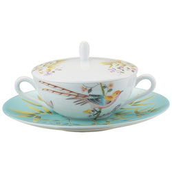A white porcelain soup bowl with turquoise trim and floral patterns, accompanied by a matching lid and tray.
