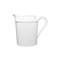 A white porcelain creamer with a pouring spout and handle, featuring a subtle textured pattern.