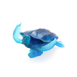 A large blue crystal glass turtle sculpture.