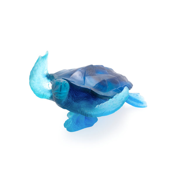 A large blue crystal glass turtle sculpture.