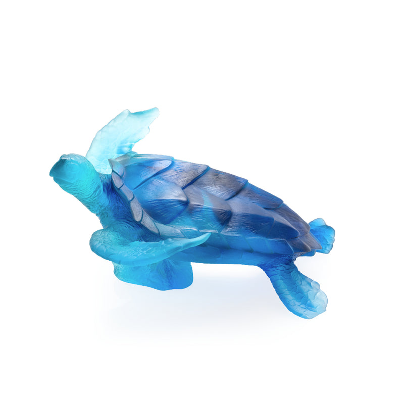 A large blue crystal glass turtle sculpture photo showing from the top