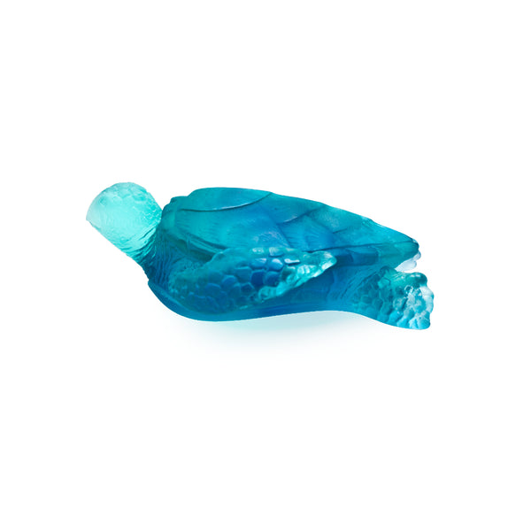A medium-sized blue crystal glass sculpture of a sea turtle with a cracked surface.