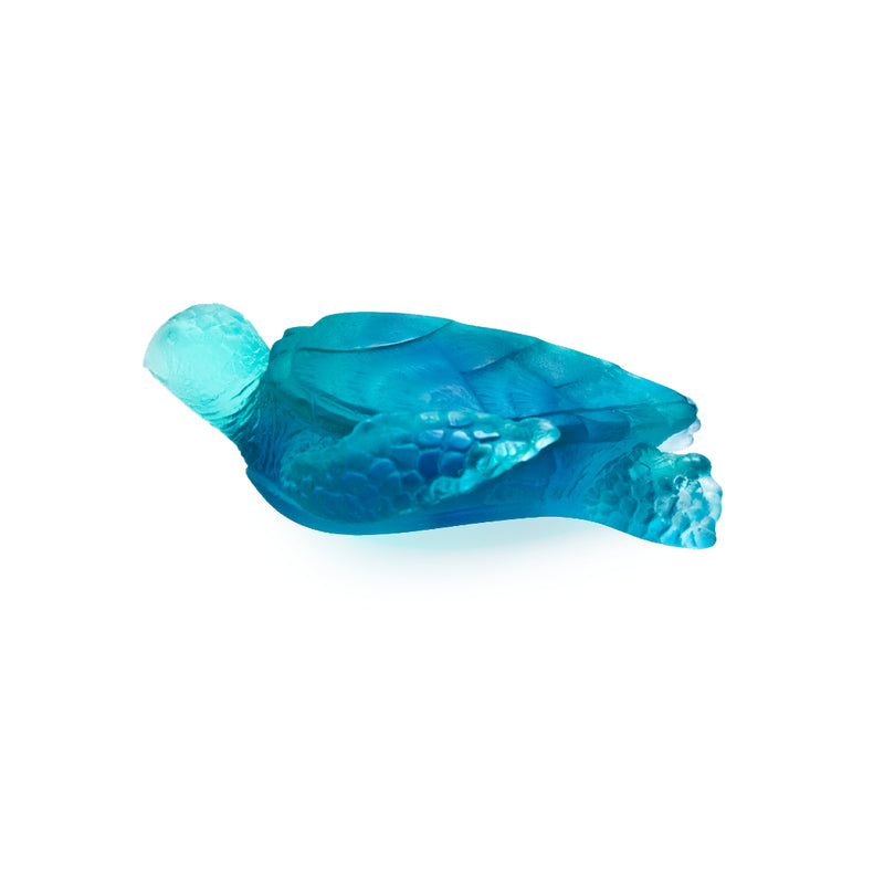 A medium-sized blue crystal glass sculpture of a sea turtle with a cracked surface.