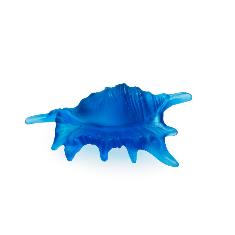 A blue crystal glass sculpture shaped like a coral reef with a winding pathway through the center.