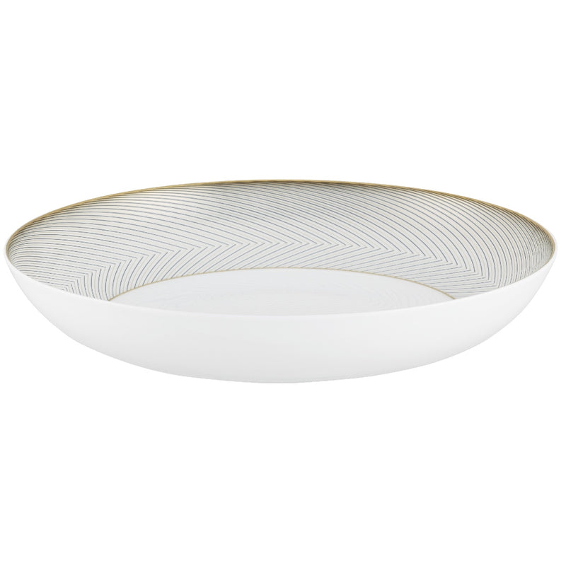 A white, gold, and brown Raynaud porcelain deep plate with geometric motifs.