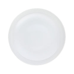 A white porcelain deep plate with a simple and elegant design from the 'Uni' Collection by Raynaud.