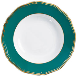 A deep turquoise and gold porcelain plate with a scalloped and gilded edge, featuring a simple central design.