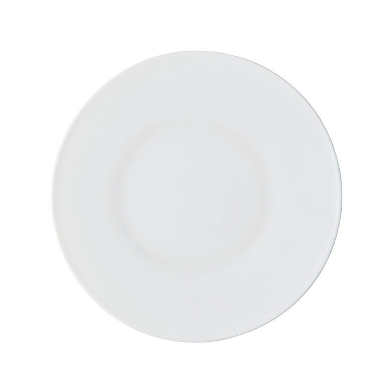A round white porcelain dessert plate with a smooth surface.