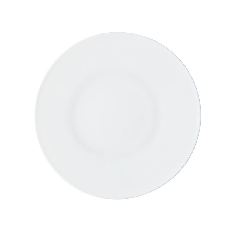 A round white porcelain dessert plate with a smooth surface.