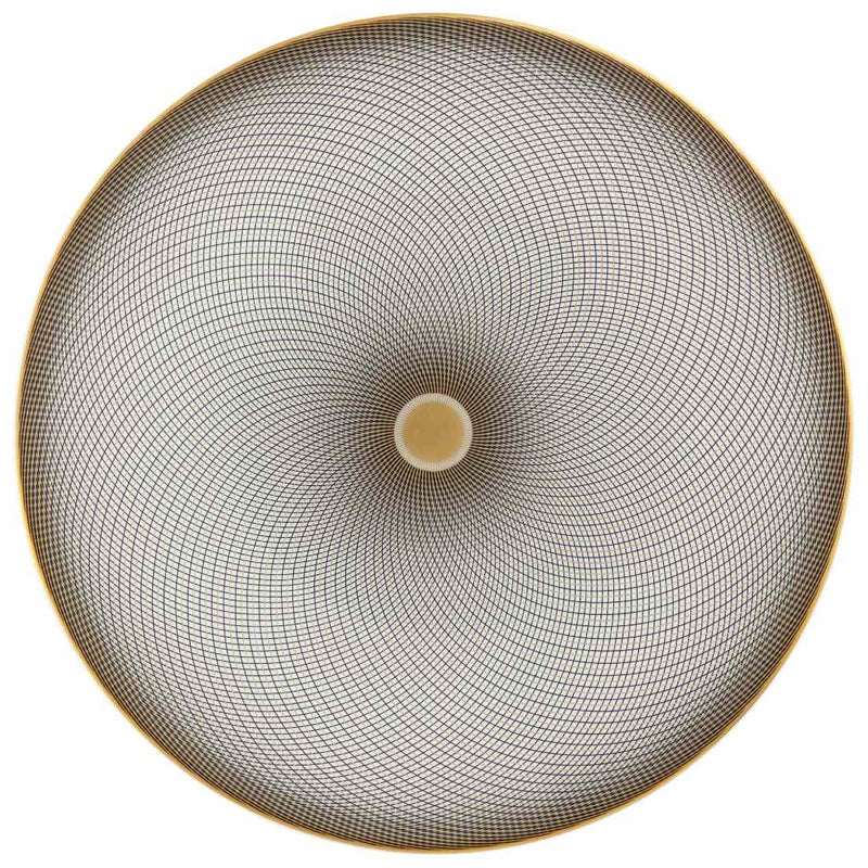 A white porcelain dessert plate with geometric black and gold curves on a gold background.