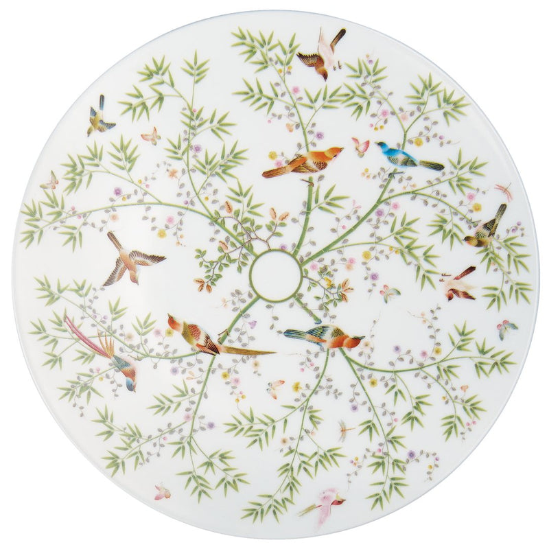 white porcelain plate with small birds and floral design