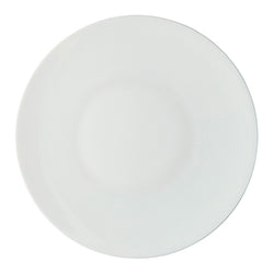 A white porcelain dinner plate with a simple, elegant design from the 'Uni' collection by Raynaud.