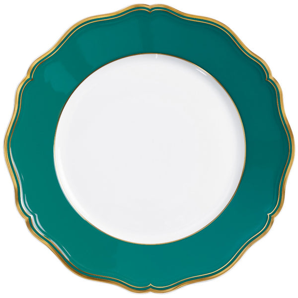 A round, turquoise and gold porcelain dinner plate with a scalloped edge and gilded contour.