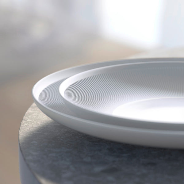 2 stacked plates from Stella Satin White velvety matte porcelain dinner plate by SIEGER by FÜRSTENBERG