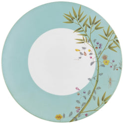 A turquoise porcelain dinner plate with floral and butterfly motifs in brown and green accents.