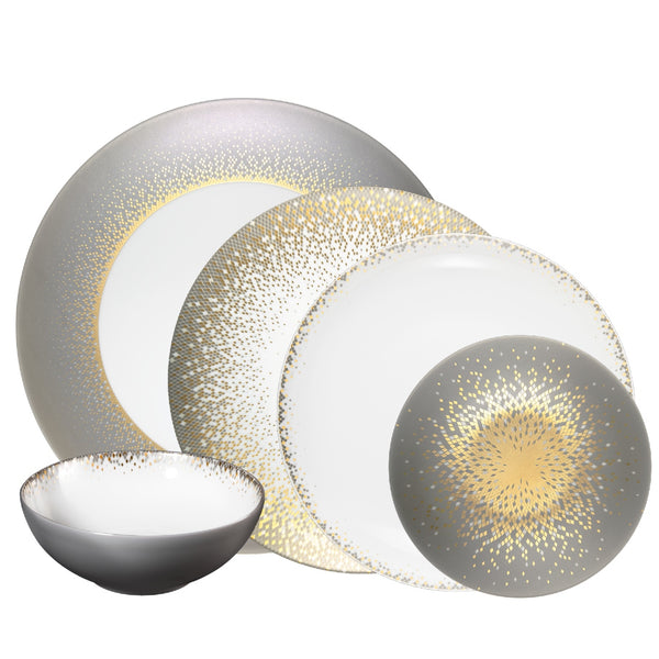 A set of Haviland Souffle d'Or porcelain dinnerware, including plates and bowls with a gold, silver, and white color scheme.