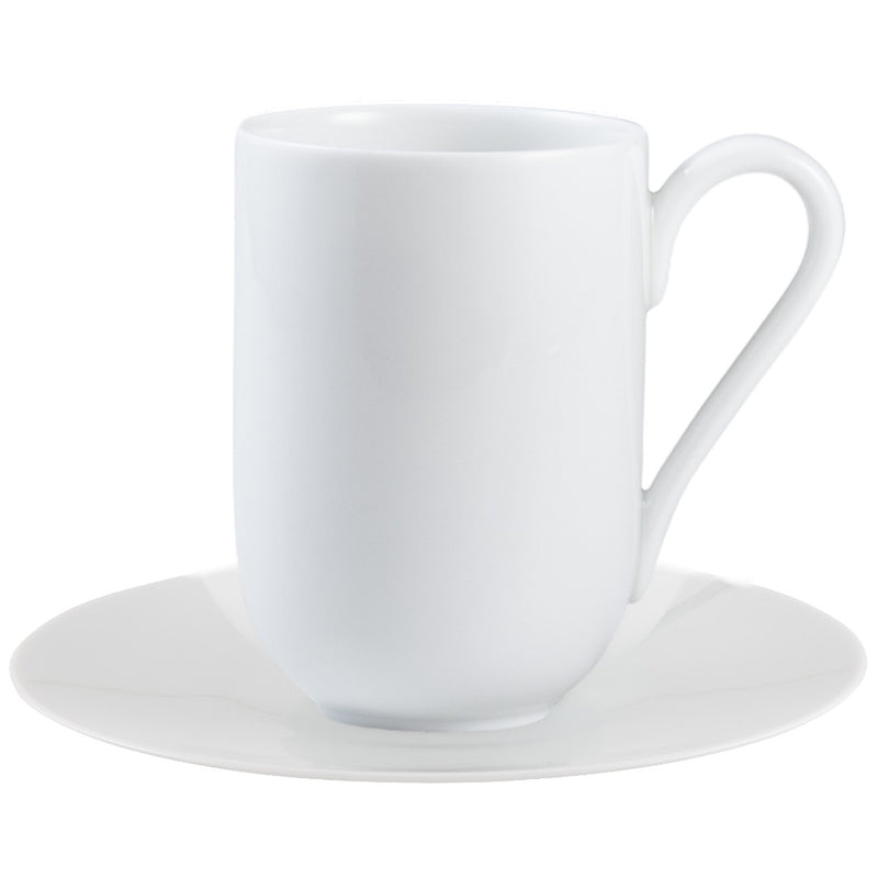 A white porcelain espresso cup with a handle on the side, placed on a matching white saucer.