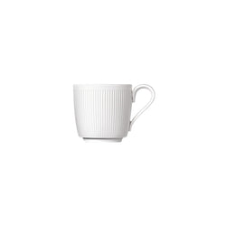 A white porcelain espresso cup with gentle relief lines and a velvety-matt finish.