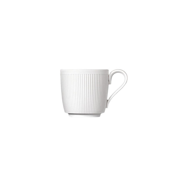 A white porcelain espresso cup with gentle relief lines and a velvety-matt finish.