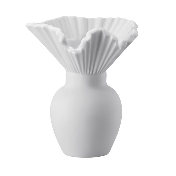 A white matte porcelain vase with a bulbous shape and a pleated collar design.