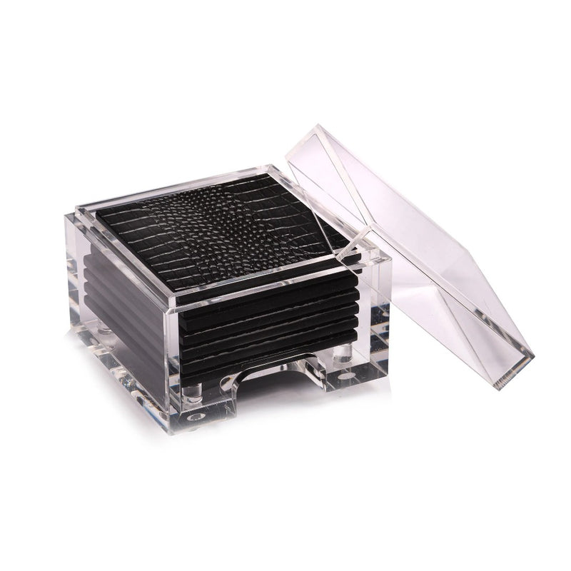 A set of black acrylic coasters with a faux python design, displayed in a clear acrylic box.