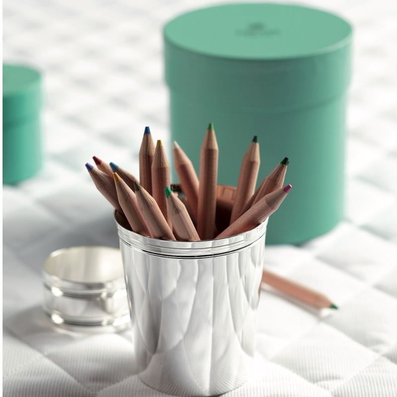 Silver-plated Filets napkin ring by Ercuis next to pencil holder.