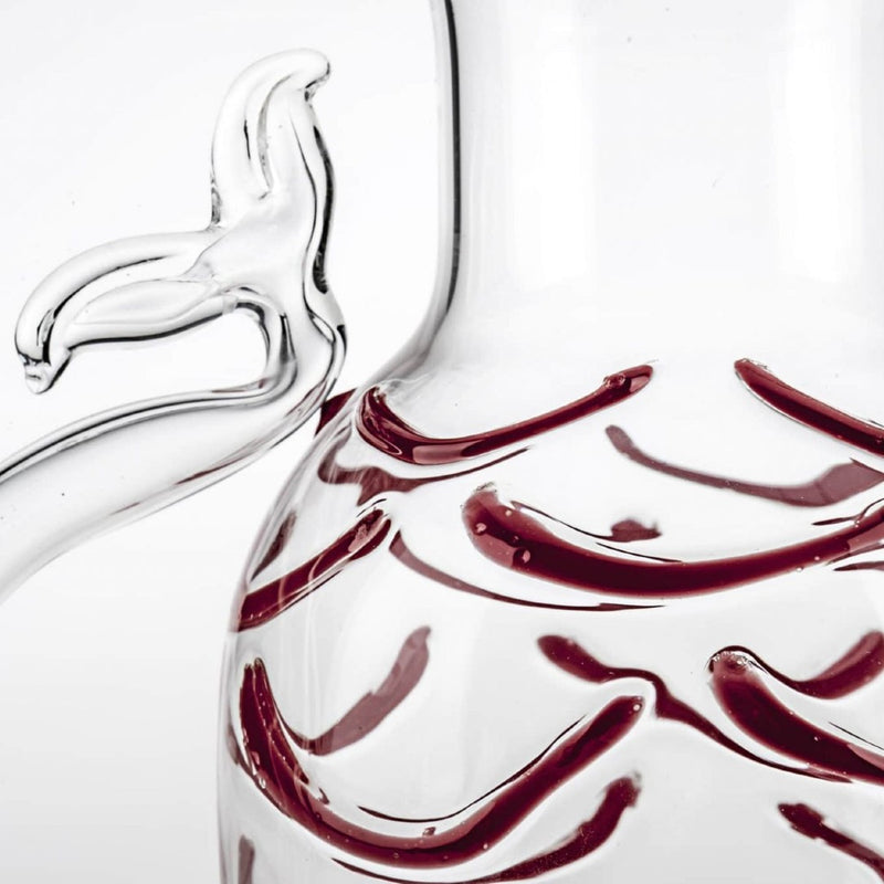 Close-up of the Fish Tail Water Jug in red Murano glass with sculptural handle by Casarialto