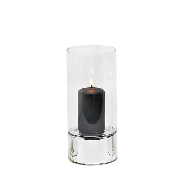 A silver and clear glass hurricane lamp candle holder with a lit candle inside, on a white background.