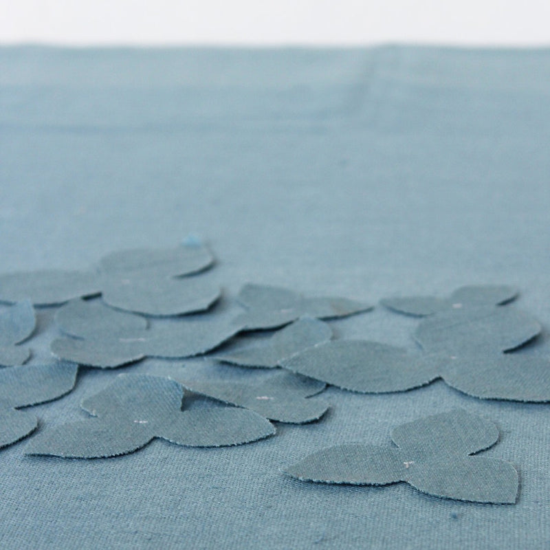 apliquee flowers in blue fabric