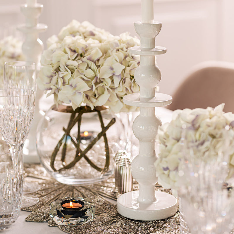 styled table with white flowers and Imperial white glazed ceramic candle holder by Adriani e Rossi 