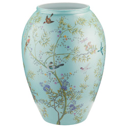 A turquoise-colored porcelain jar featuring a floral and animal pattern, part of the 'Paradis' collection by Raynaud.
