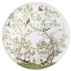 A white porcelain platter with a floral and bird pattern.