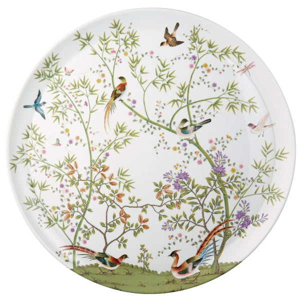 A white porcelain platter with a floral and bird pattern.