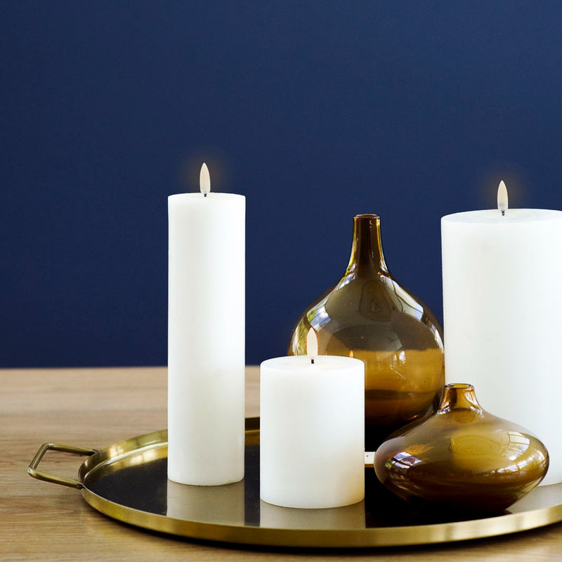 styled tray with LED pillar candle in Nordic White by Uyuni Lighting, 10cm tall, and other sizes real flame effect