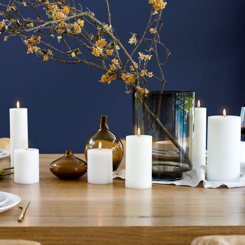 styled table with LED pillar candle 15cm in Nordic White by Uyuni Lighting, real flame look