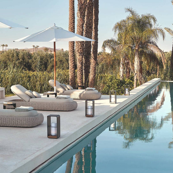 styled pool side with Manutti Lumo lantern in lava