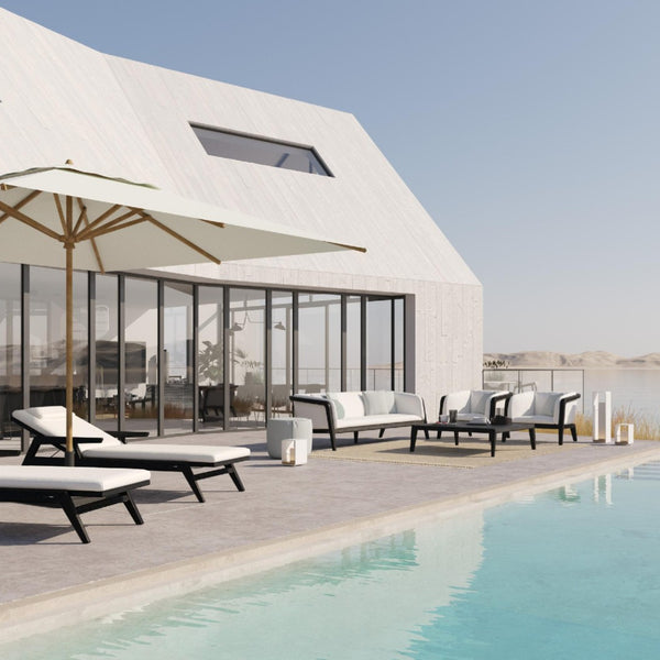 Outdoor by the pool featuring modern furniture and Lumo lantern in white by Manutti