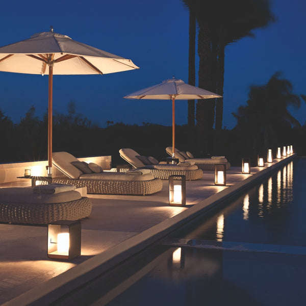 poolside evening decorated with lumo lanterns by Manutti