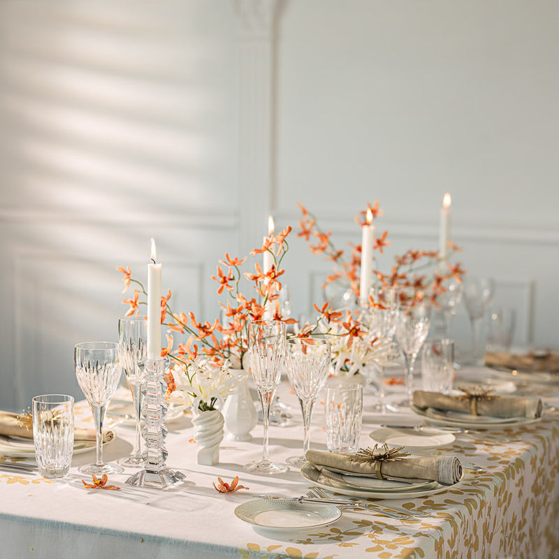 a table with candles and flowers