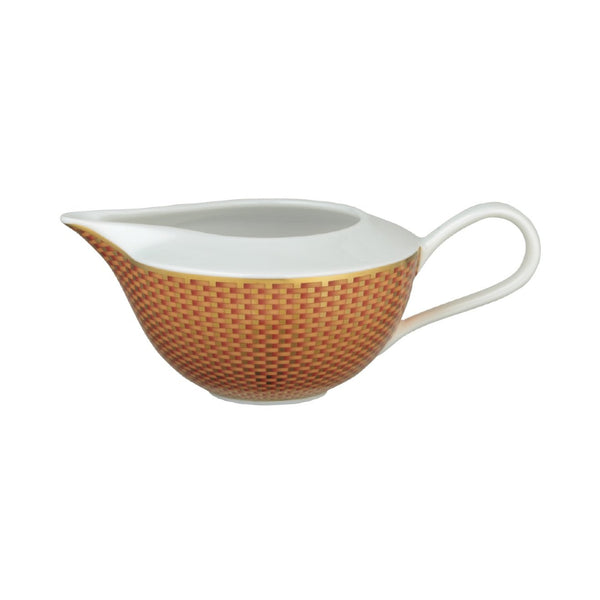 Raynaud Trésor orange porcelain milk jug and creamer with gold-accented honeycomb design