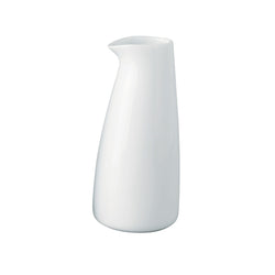 A white porcelain milk pot with a wide rim , against a plain background.