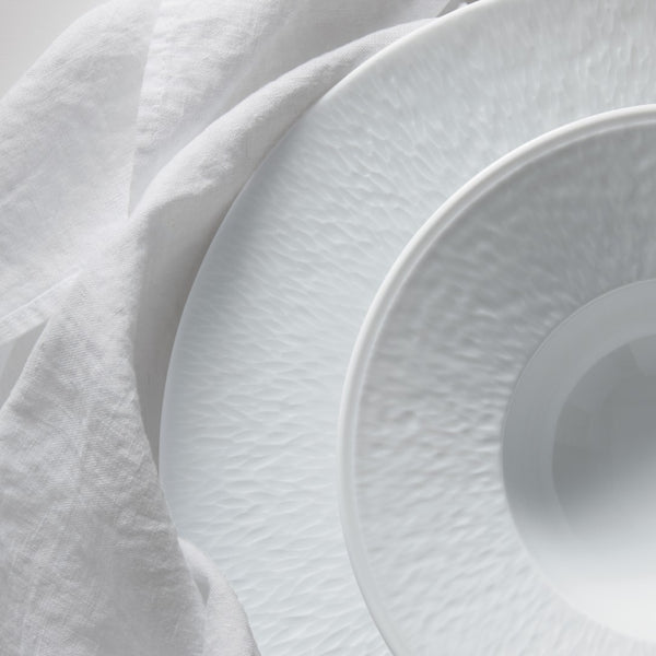 stacked up plates in Minéral White porcelain by Raynaud Limoges