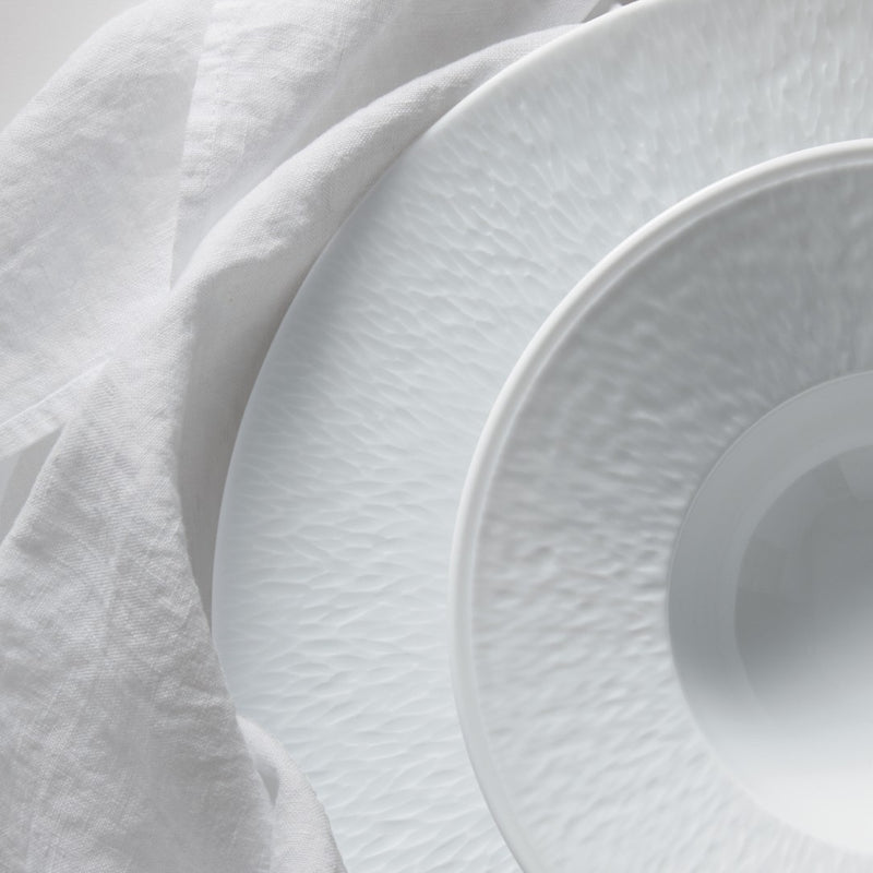 stacked up plates in Minéral White porcelain by Raynaud Limoges