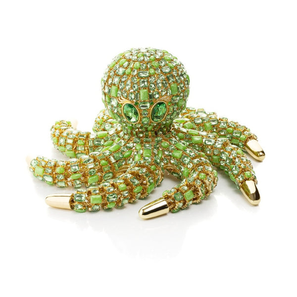 Gold-trimmed bejewelled octopus sculpture with green crystals