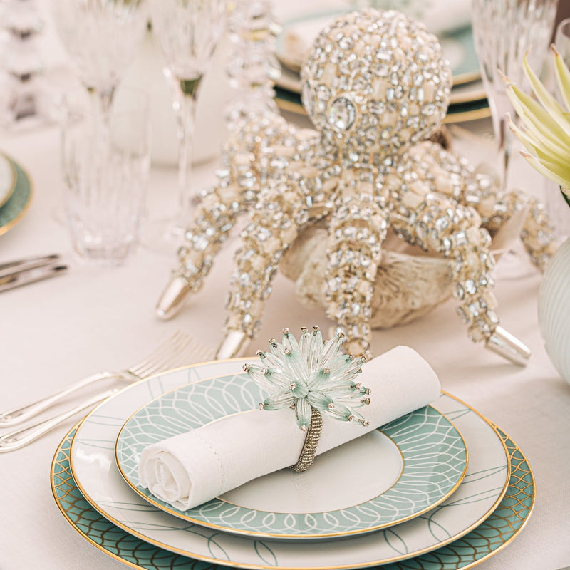 table decor featuring a bejewelled lobster figurine and napkin ring